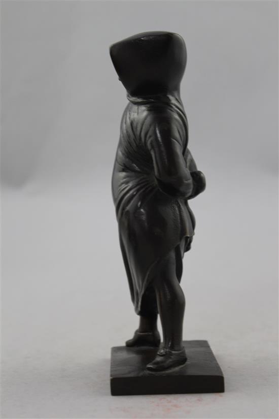 A small Italian patinated bronze of a figure standing in a hooded cloak, 6.75in.